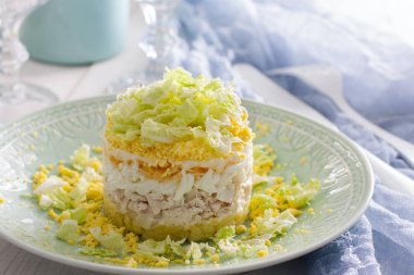 Layered salad with chicken and Peking cabbage 