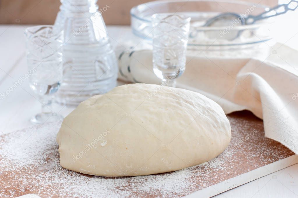 Raw unleavened dough made using vodka, selective focus