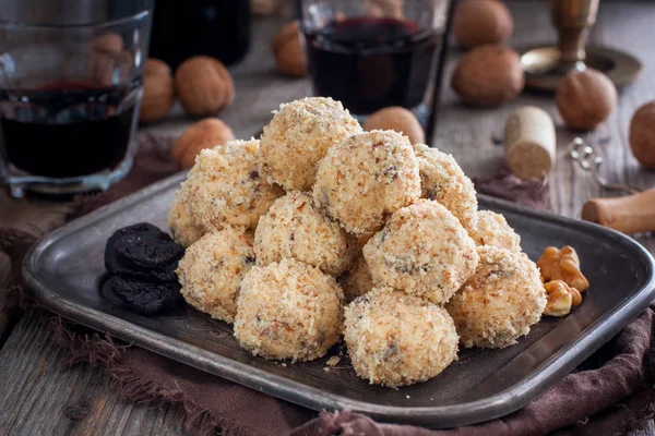 Snack cheese balls with prunes and walnuts on a metal platter, horizontal — Stock Photo, Image