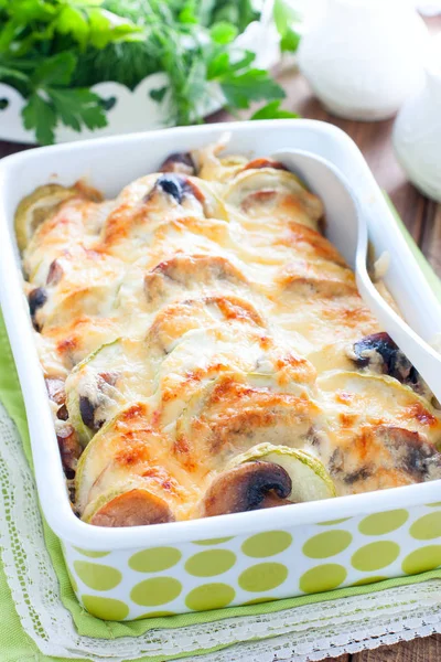 Zucchini baked with champignons with sour cream and cheese, selective focus — Stock Photo, Image