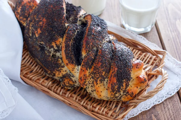 Homemade challah with poppy seeds in a wicker tray, horizontal — Stock Photo, Image