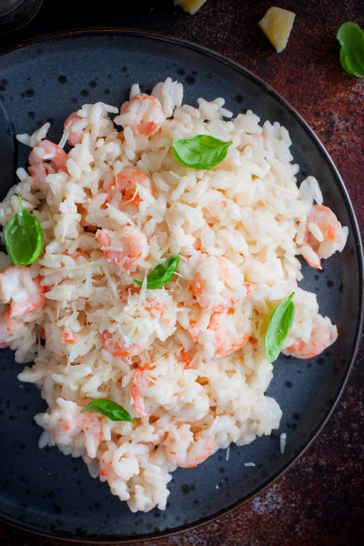 Shrimp risotto with cream sauce, selective focus