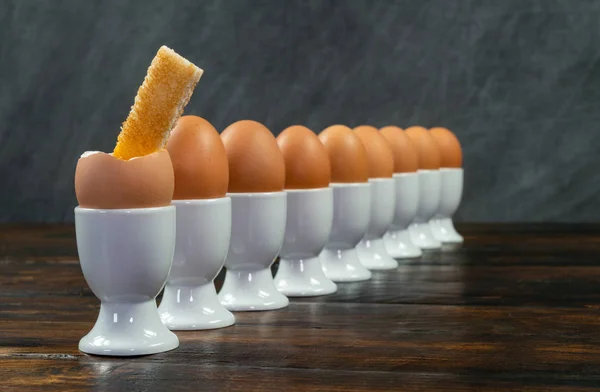 Row Boiled Eggs White Egg Cups Wooden Table First Egg — Stock Photo, Image