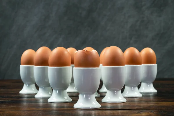 Ten Boiled Eggs White Egg Cups Wooden Table Triangle Arrangement — Stock Photo, Image