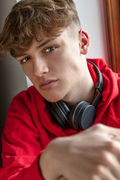 Male Teenager Young Adult Wearing Red Hoodie and Wireless Headph — Stock Photo, Image