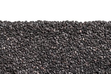 Siyah Susam taneleri. Arka plan ile üst üzerinde boş alanı ile tohum. Siyah tohumları ile sorunsuz doku.