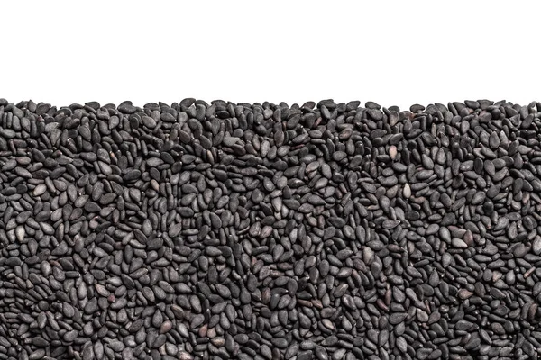 Siyah Susam taneleri. Arka plan ile üst üzerinde boş alanı ile tohum. Siyah tohumları ile sorunsuz doku.