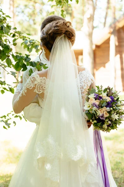 White long veil of bride back view