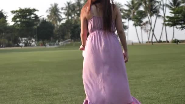 Asian Chinese Woman Slow Motion Walking Grass Lawn — Stock Video