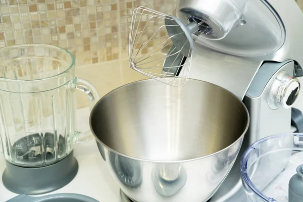 disassembled multifunctional food processor on kitchen countertops