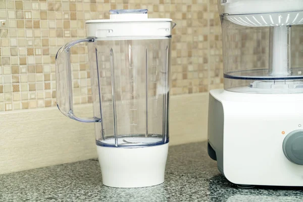 disassembled multifunctional food processor on kitchen countertops. Modern Liquidiser. Smoothie Maker. Electric Kitchen and Household Domestic Appliance