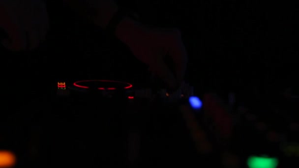 DJ working on a audiomixer at party in nightclub — Stock Video