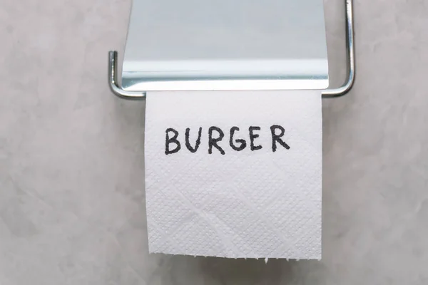 Toilet paper with text budrger in wc. Concept of personal hygiene. Fast food Concept — Stock Photo, Image