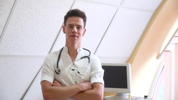 Portrait of professional doctor with stethoscope in clinic. Hospital with ultrasound devices on background — Stock Video