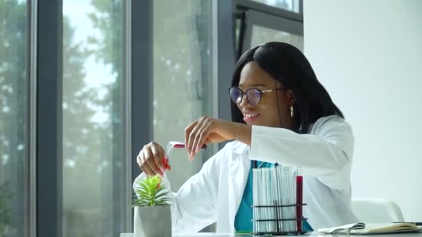 Female african scientist doctor doing blood test in laboratory. Covid 19 test — Stock Video