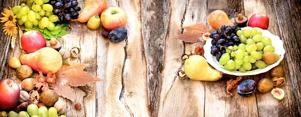 Autumn fruit on rustic table, organic, healthy seasonal fruit in healty eating