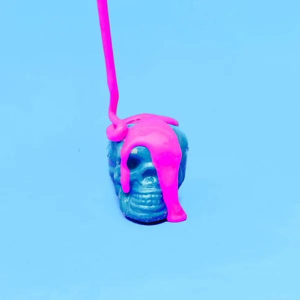 Blue Skull in pink paint. Minimal design art