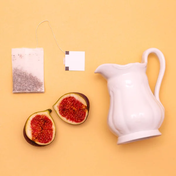 Tea set with fresh figs. Minimal flat lay creative art