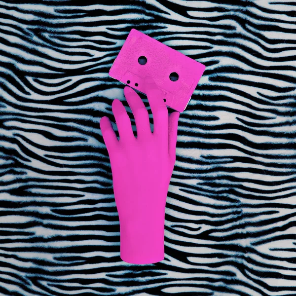 Pink hand and pink audio cassette. Zebra animal print. Minimal a — Stock Photo, Image