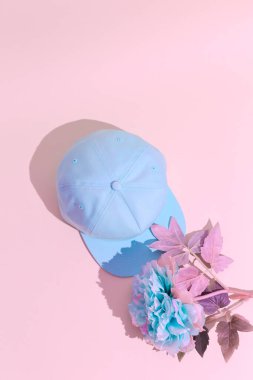 Blue flowers and blue cap. Minimal design. Fashion accessories concept. Pastel trends clipart