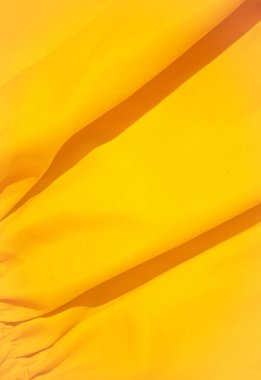 Asgari monokrom estetiği. Sarı ipek kumaş. Arkaplan dokusu kavramı