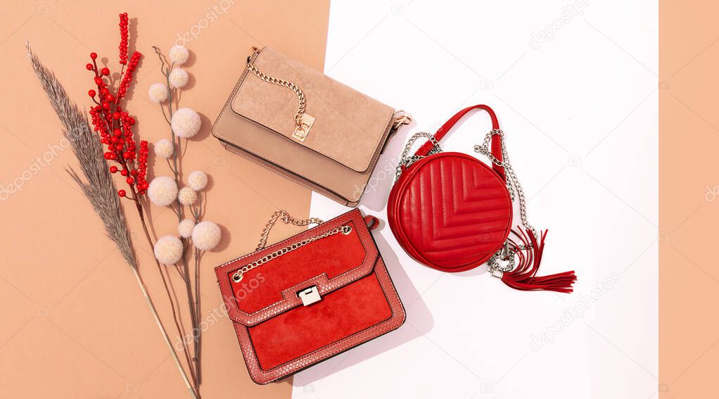 Stylish autumn accessories flat lay. Clutch bags set.  Fall winter fashion concept. Design decor beige background. Copy space
