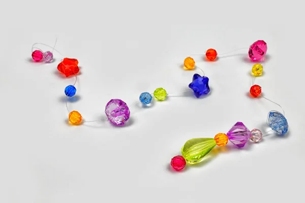 Colored beads for design on a white background — Stock Photo, Image