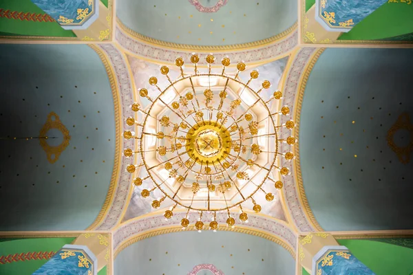 the ceiling in the church with the illuminated spring. church lamp