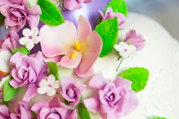 cake decoration. beautiful wedding cake with purple orchids. cake in violet tones