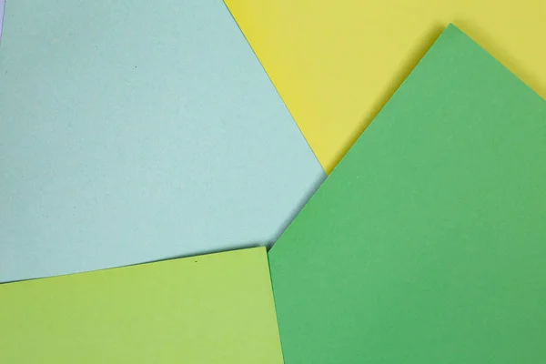 sheets of colored paper. Many colored sheets of paper are laid out in the harsh composition. background of colored paper.