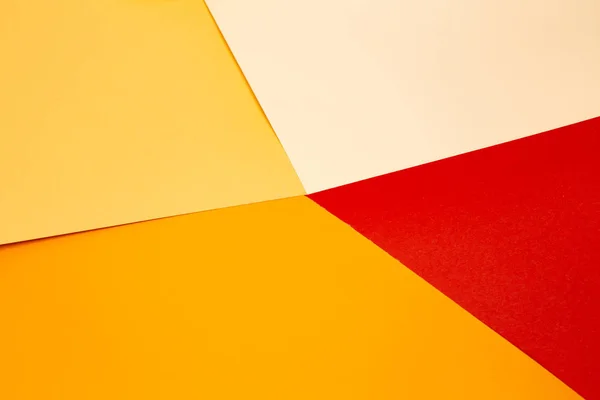 sheets of colored paper. Many colored sheets of paper are laid out in the harsh composition. background of colored paper. warm colors