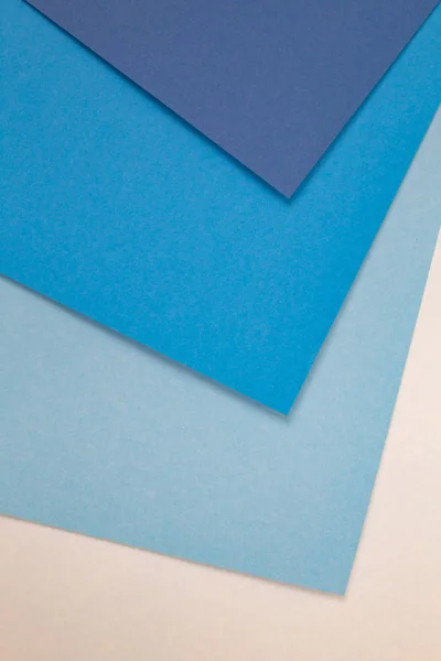 sheets of colored paper. Many colored sheets of paper are laid out in the harsh composition. background of colored paper. cold blue color.