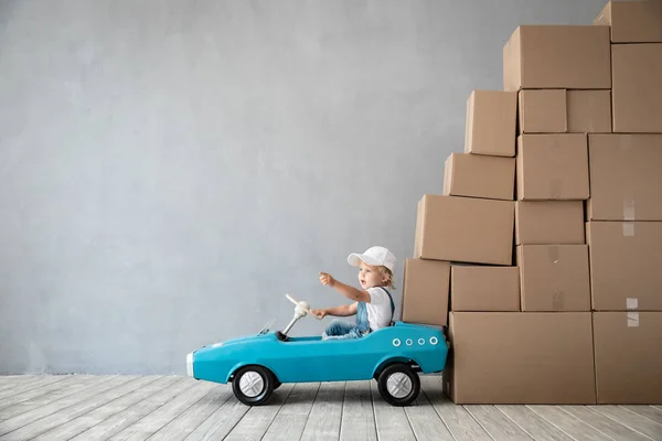 Happy Child Playing New Home Kid Driving Toy Car Moving — Stock Photo, Image