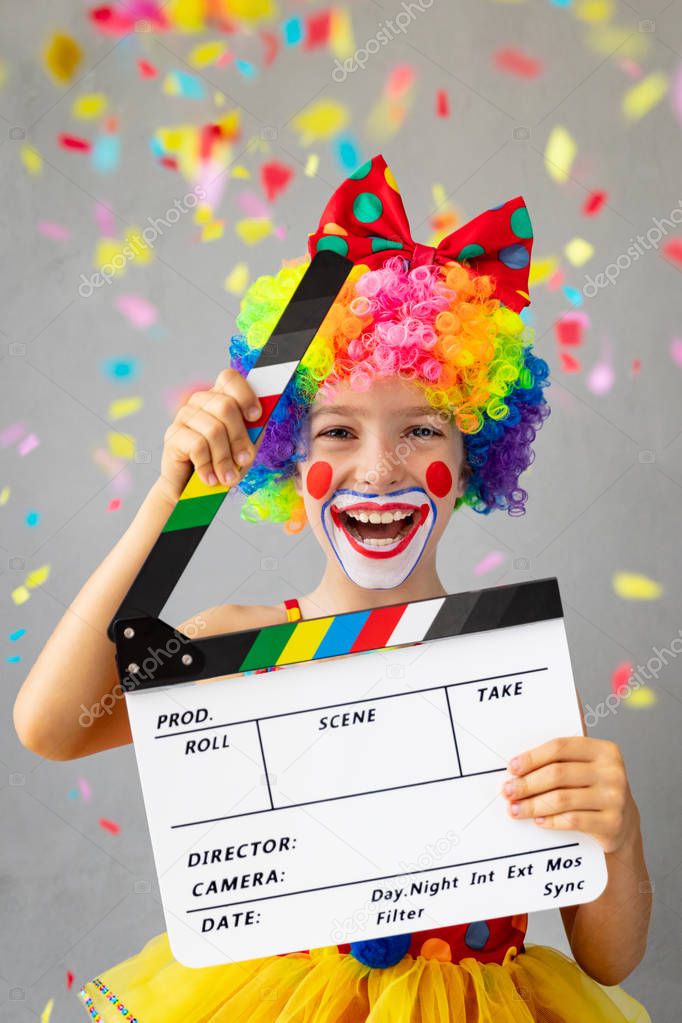 Funny kid clown. Happy child playing at home. 1 April Fools day concept