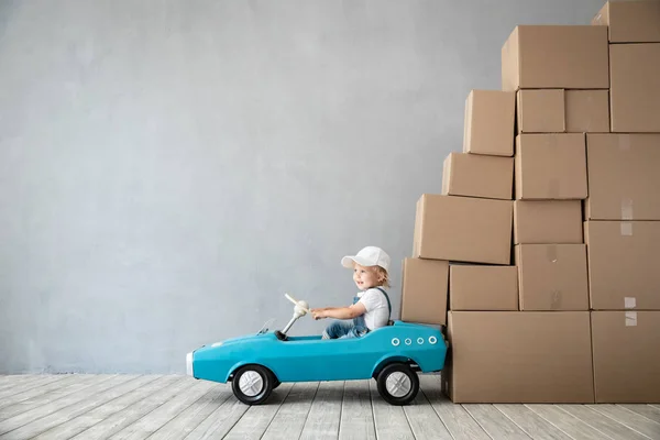 Happy Child Playing New Home Kid Driving Toy Car Moving — Stock Photo, Image