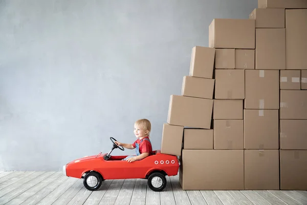 Happy Child Playing New Home Kid Driving Toy Car Moving — Stock Photo, Image