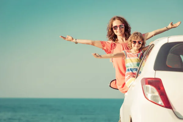 Happy family travel by car. People having fun on the beach. Summer vacation concept