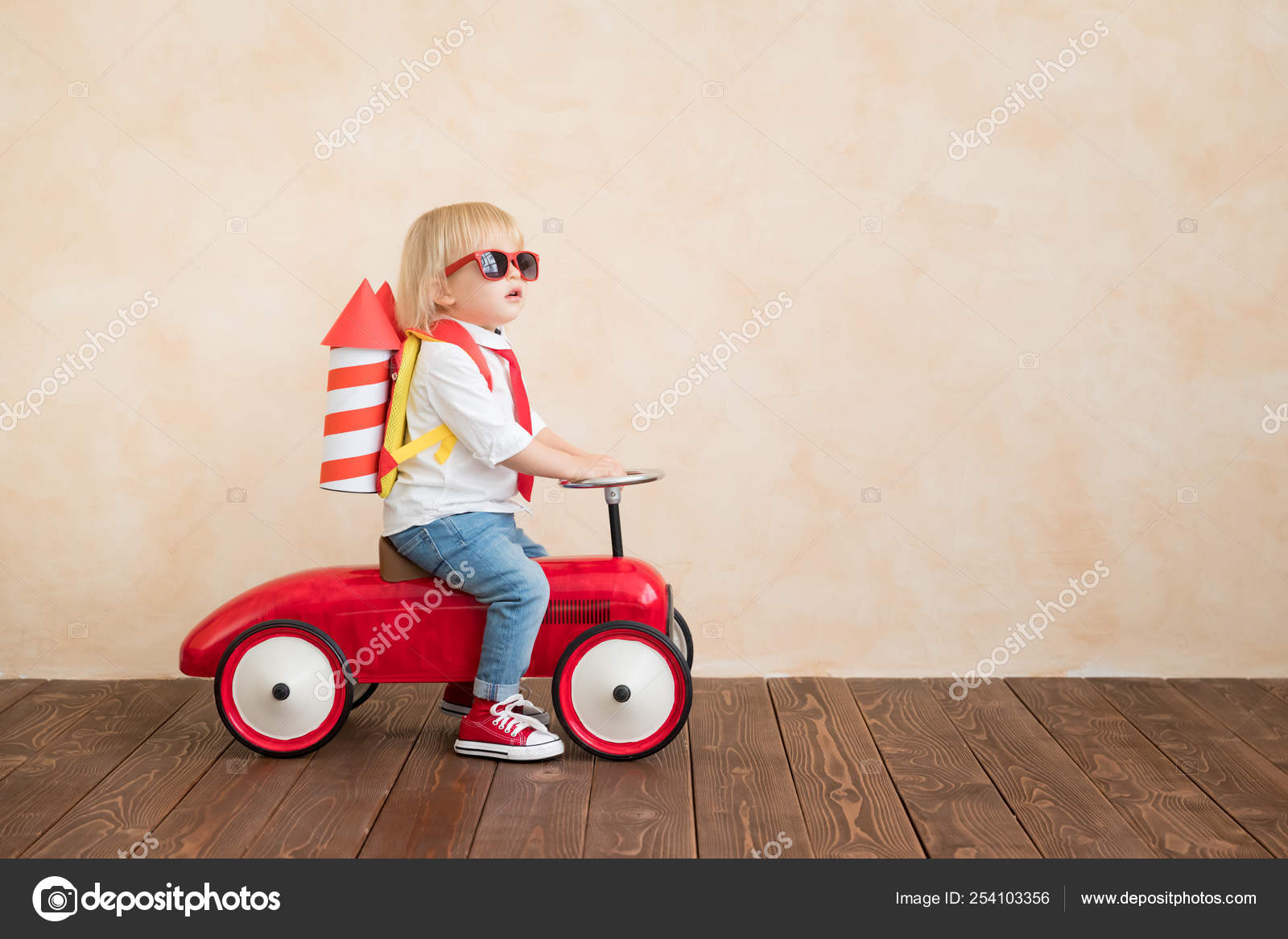 child driving toy car