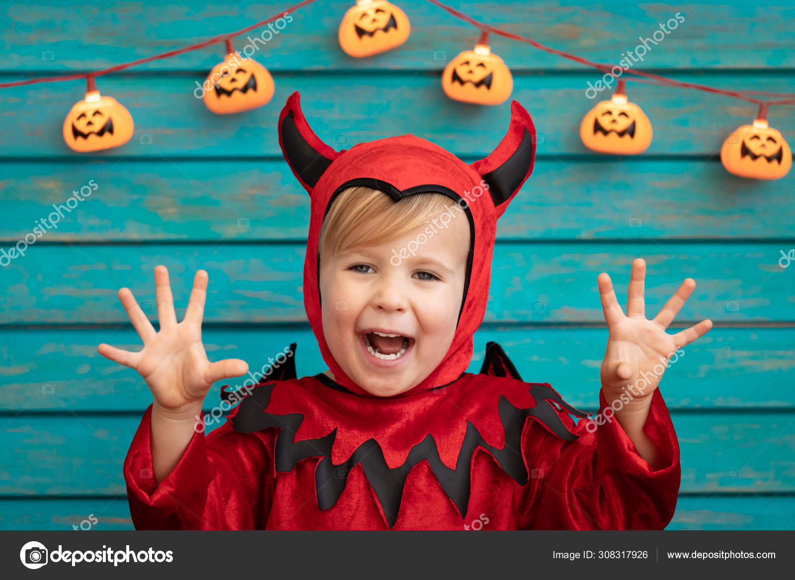 Happy child dressed Halloween costume Stock Photo by ©Yaruta 308317926