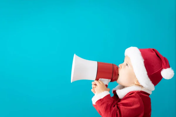Happy Child klädd i Santa Claus kostym speaking by MegaFon — Stockfoto