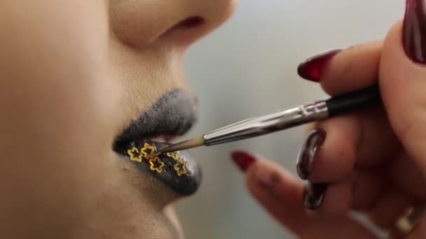 Arany ragyog fekete ajkak — Stock videók