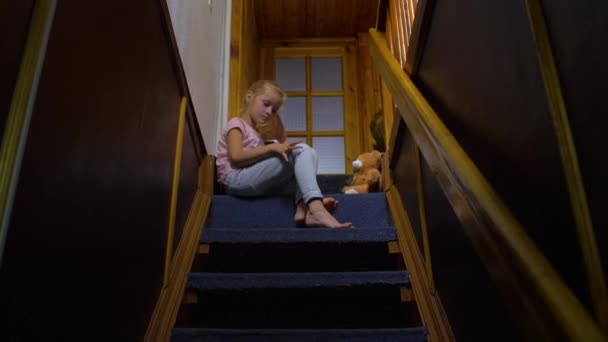 Little Girl Sitting On Stairs — Stock Video