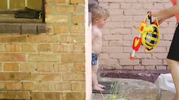 Little Boy And Water Gun — Stock Video