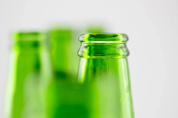 Colorful empty beer bottles, lots of empty beer bottles. Closeup, daylight. Beer\'s over, party\'s over.