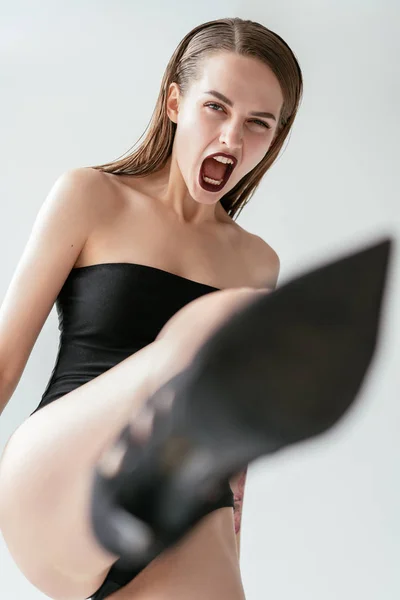 Aggressive Shouting Woman Kicking Leg High Shoes Camera Stress Concept — Stock Photo, Image