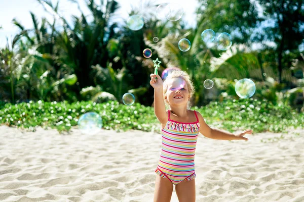 Little Blonde Girl Playing Soap Bubbles Topical Beach — Stock Photo, Image