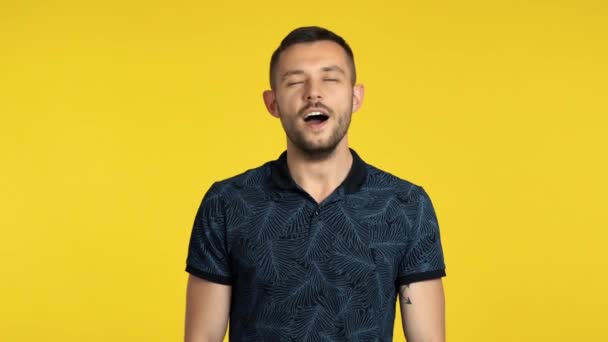 Young Man Yawning Yellow Background — Stock Video