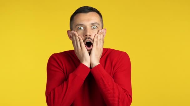 Shocked Young Man Yellow Background — Stock Video