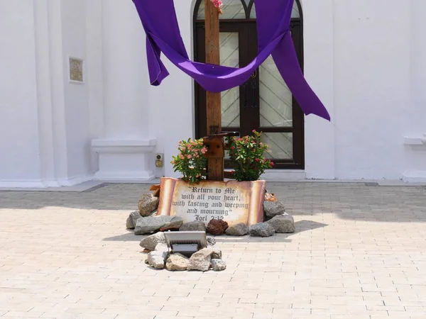Close up of the written verse at the foot of the cross infront of St. Peter\'s Church in Melaka City, Malaysia.