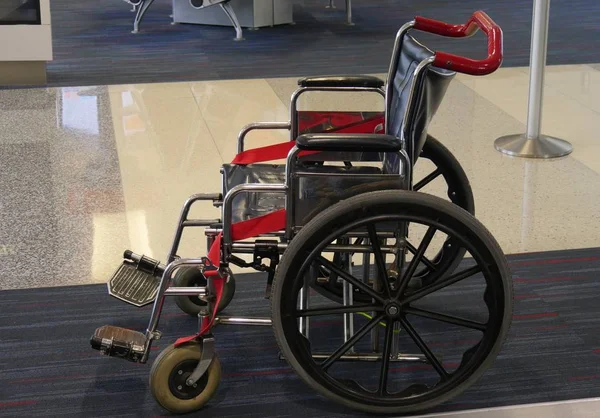 Close up of a wheelchair accessible for passengers who needs it an an airport arrival area.